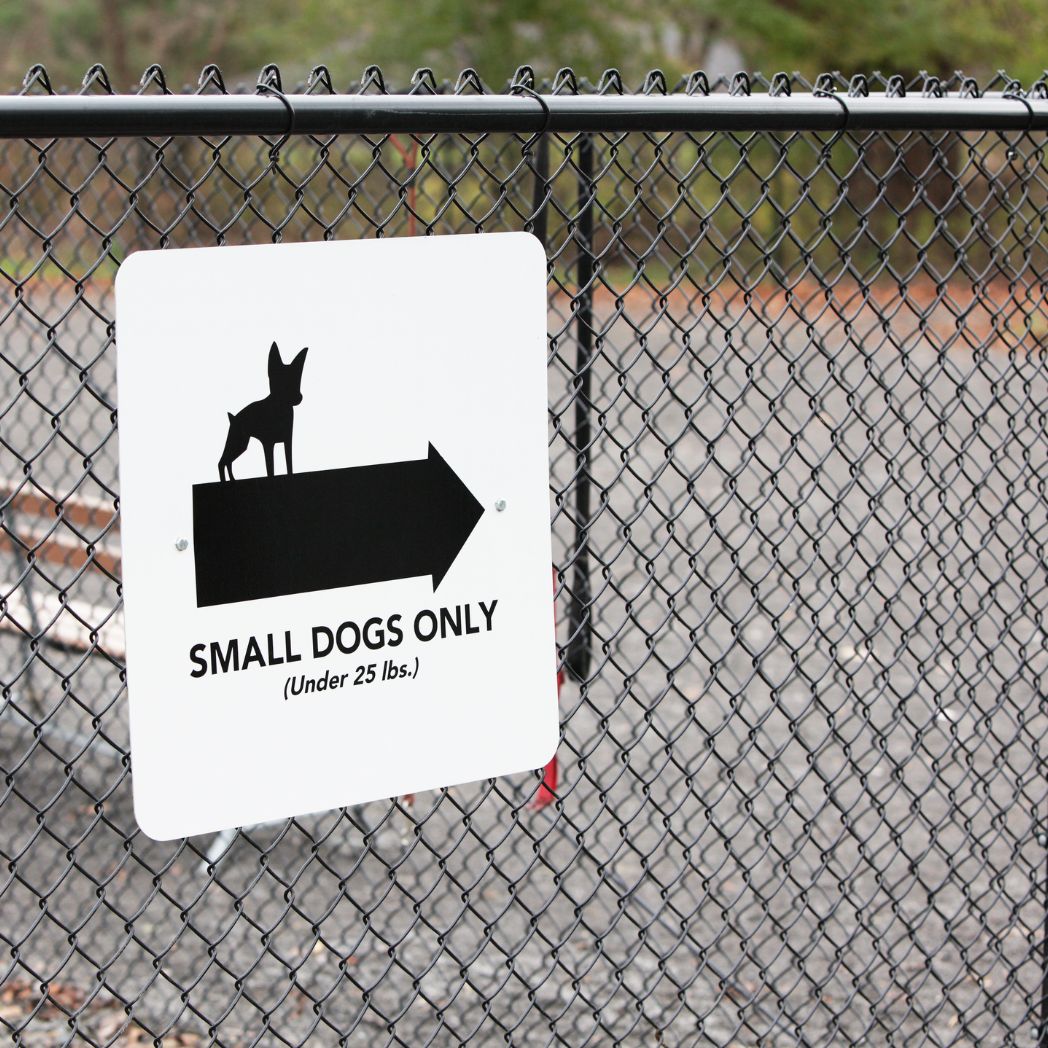 Warning sign installed near an underground dog fence boundary