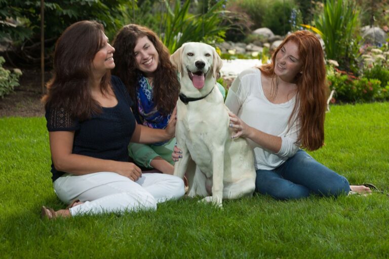 Family enjoying a safely contained dog after underground dog fence installation in Michigan