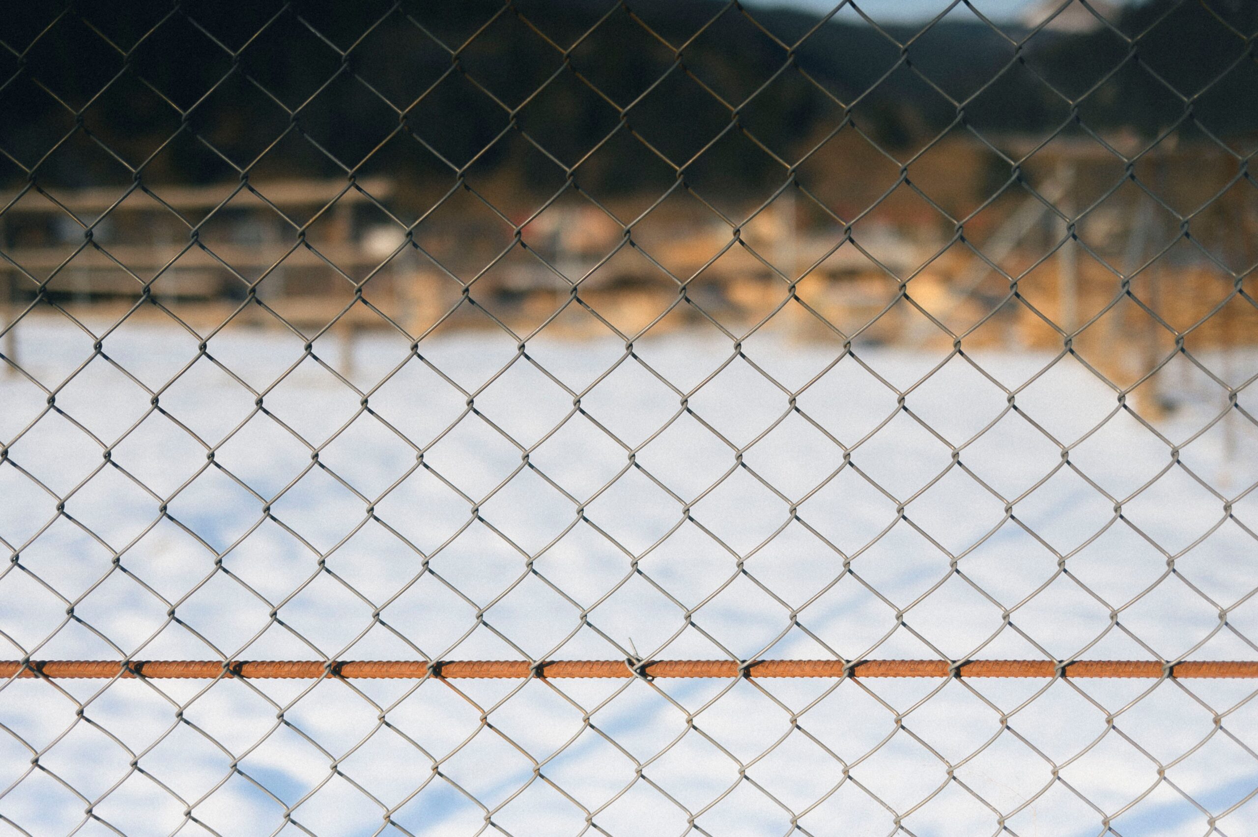 Chain link fence marking a secure containment boundary