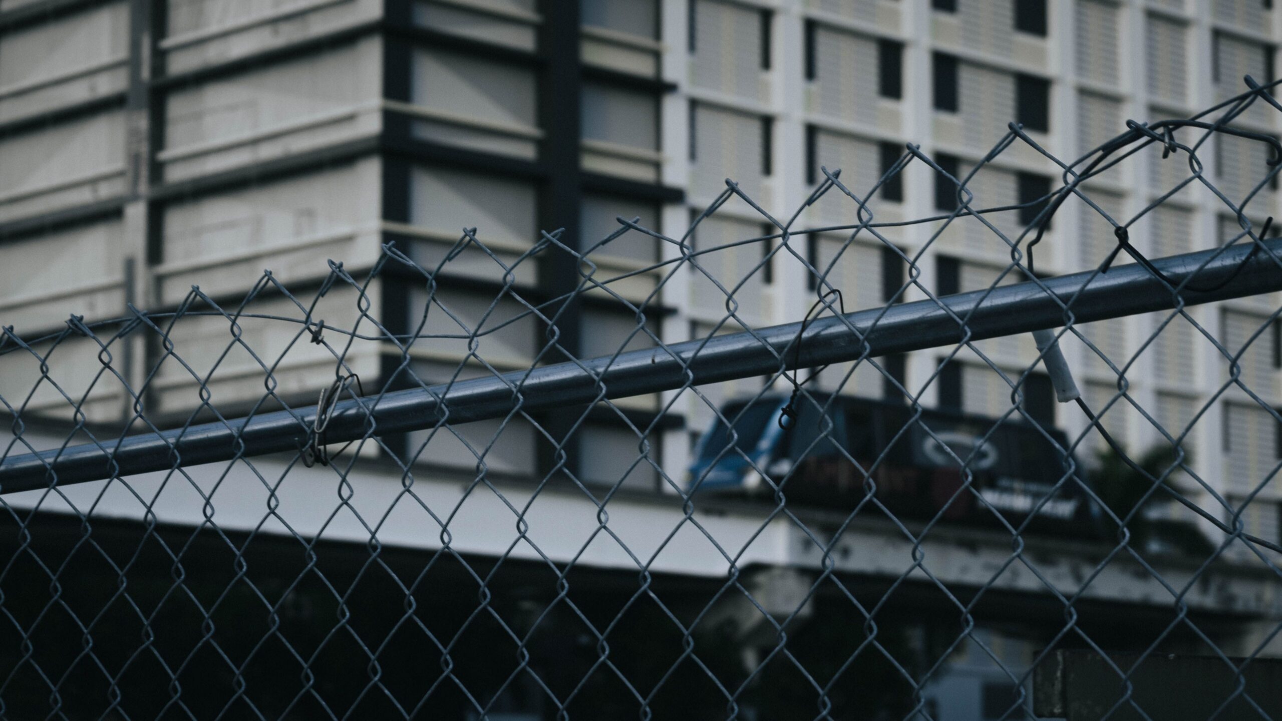 Black chain link fence around commercial property
