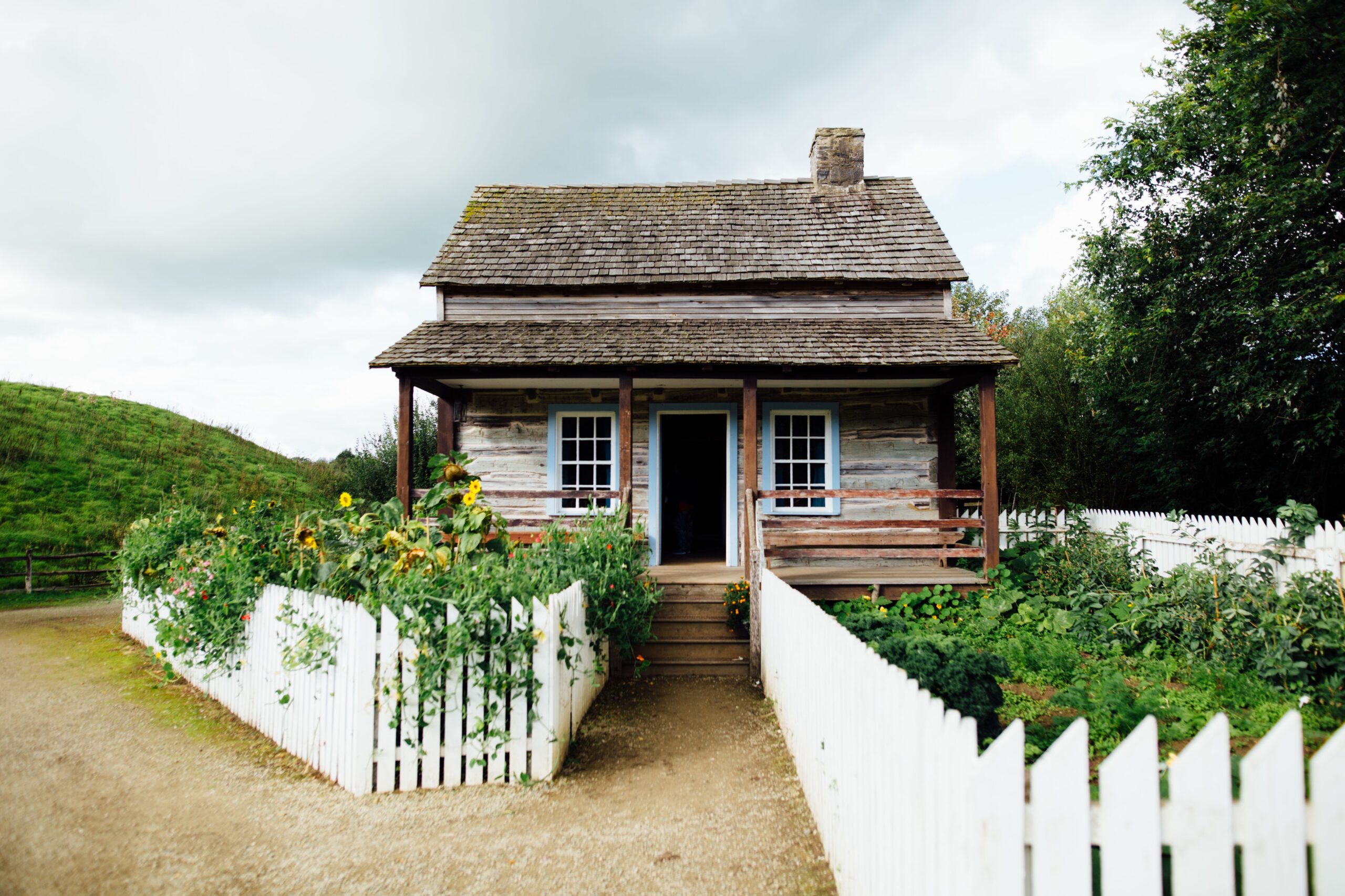 Small cottage with white picket fencing